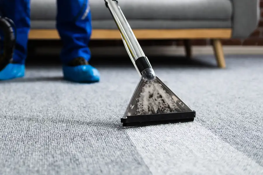 Professional carpet cleaning with an extraction wand